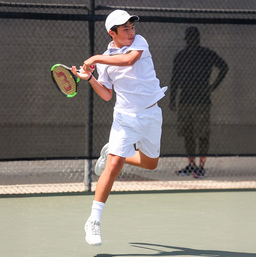 Andy Nguyen wearing all white competing at USTA Southern California Junior Sectionals in 2019.