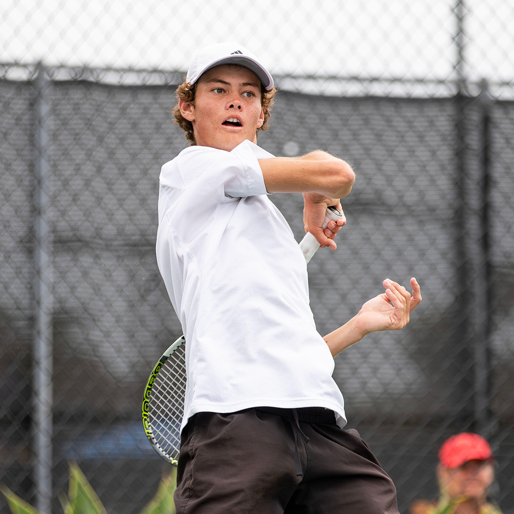 Dominique Rolland fires a forehand during his first-round win at the SoCal Pro Series, earning his first ATP ranking point.