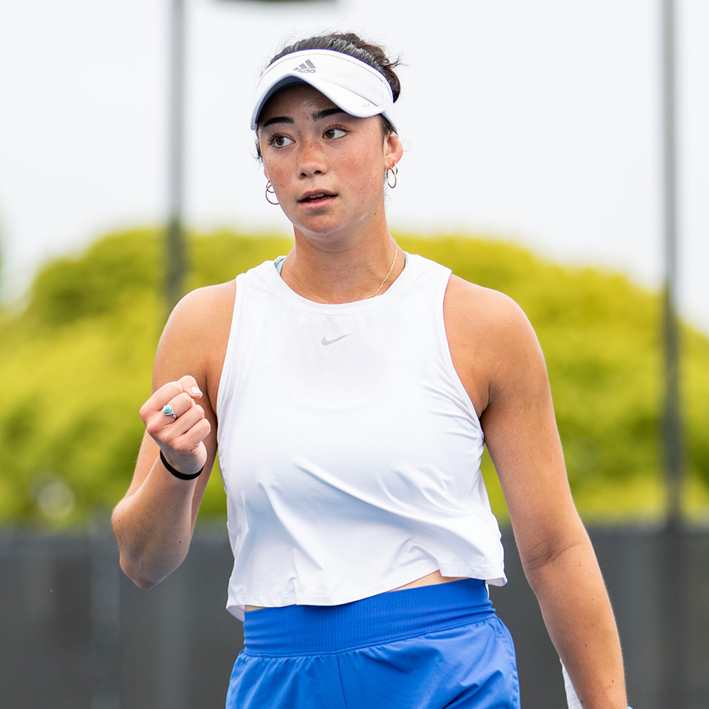 Olivia Center fist pumping during a tennis match