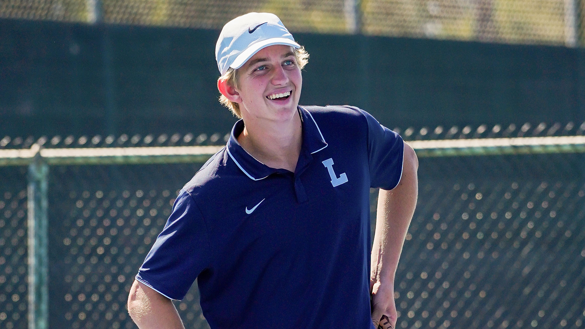 Braun Levi smiling on a tennis court in Southern California. Live Like Braun Levi: The Bright Legacy of Loyola High School’s Tennis Star