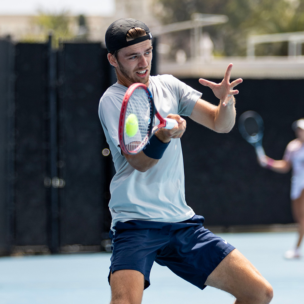 Stian Klaassen hits a forehand in his tennis match