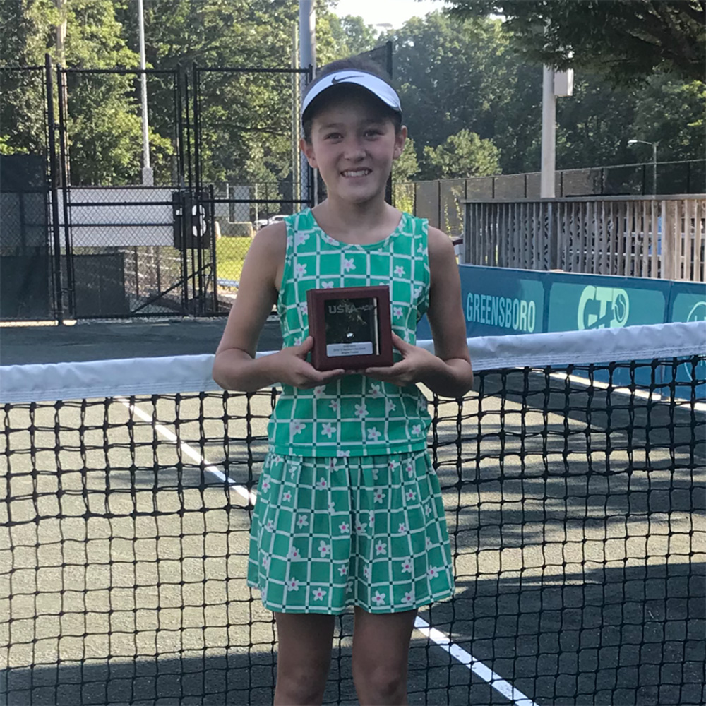 Danielle Han smiles with the USTA Silver Ball in the Girls’ 12 Singles at the USTA National Clay Court Championships.