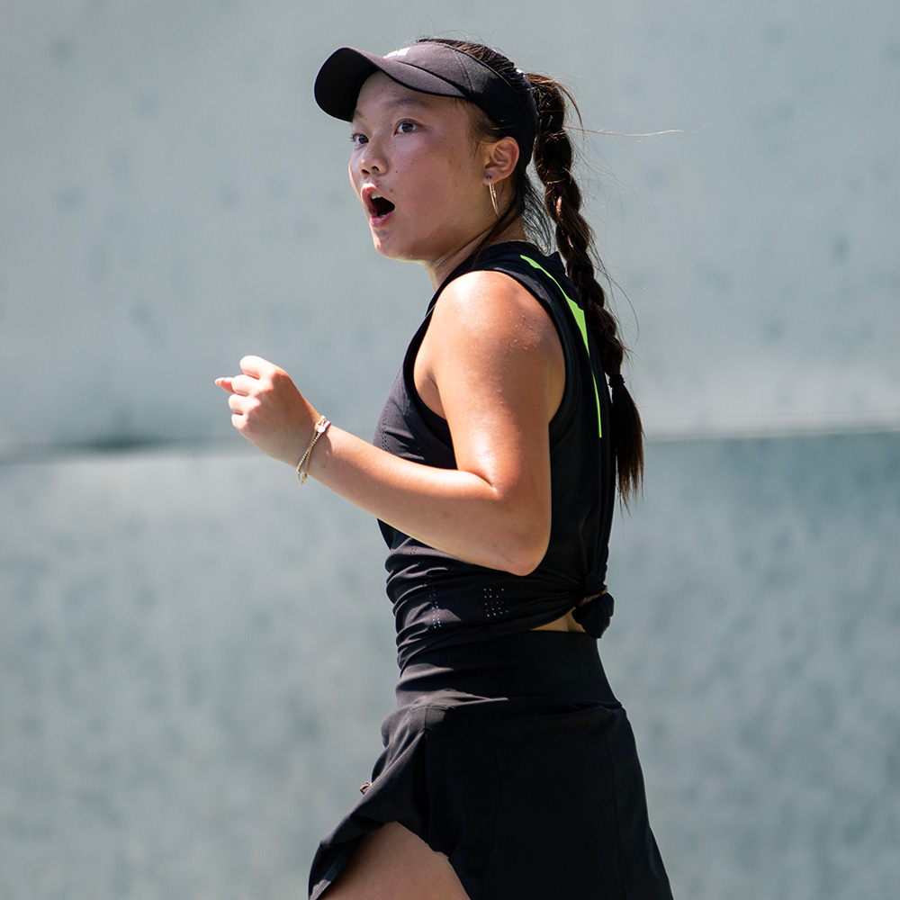 Lani Chang pumps her fist as she competes in her SoCal Pro Series debut at Rancho Santa Fe while wearing all black