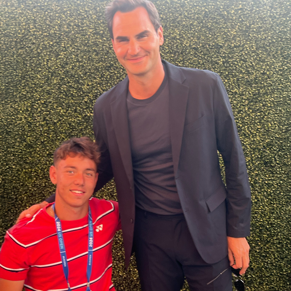 Charlie Cooper and Roger Federer smile in the US Open player's garden.