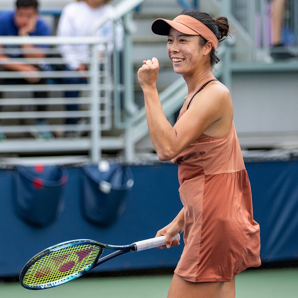 Ena Shibahara smiles and pumps her fist in the air during her 2024 US Open singles match