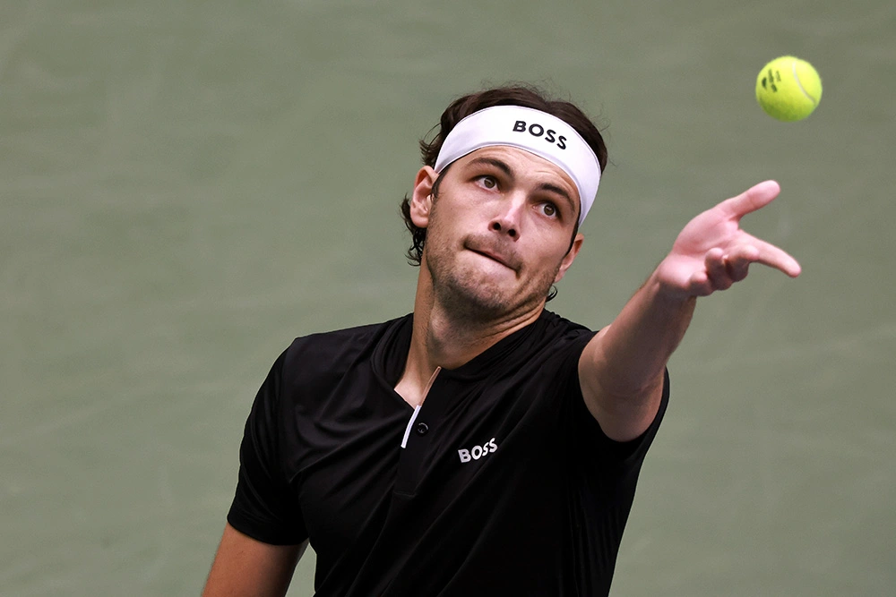 Taylor Fritz serves during a men's singles match at the 2024 US Open in Flushing, New York.