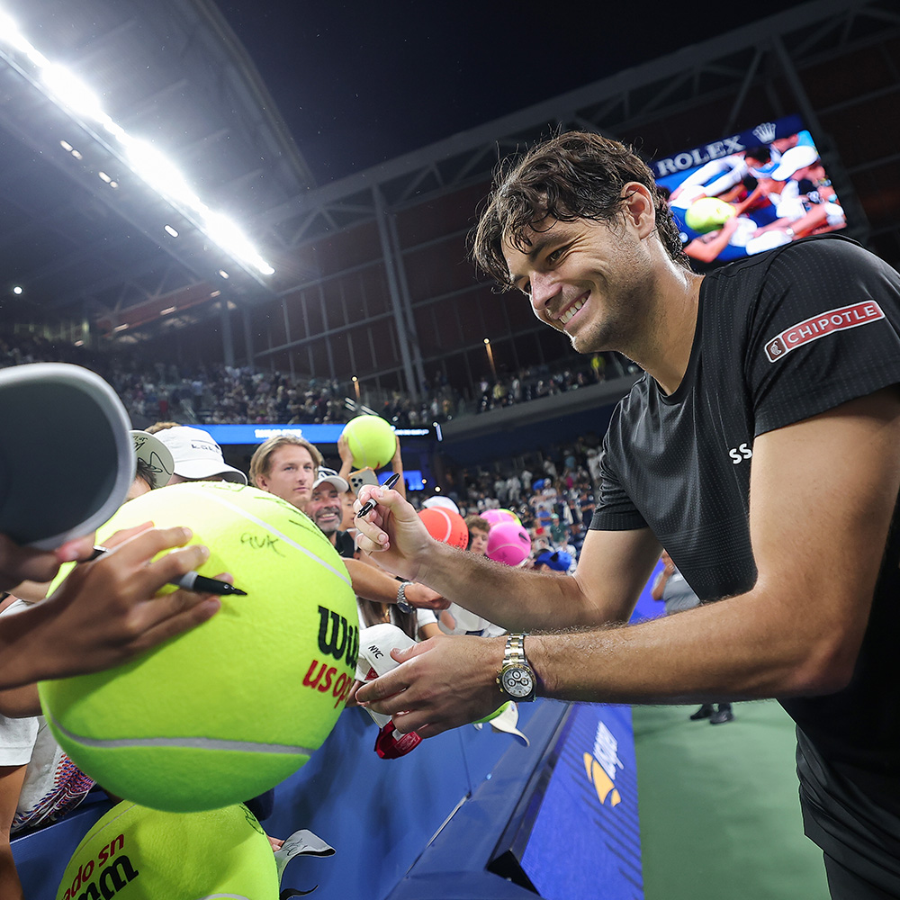 Taylor Fritz signs an autograph for fans during a men's singles match at the 2025 US Open on Sunday, Aug. 31, 2025 in Flushing, NY. (Dustin Satloff/USTA)