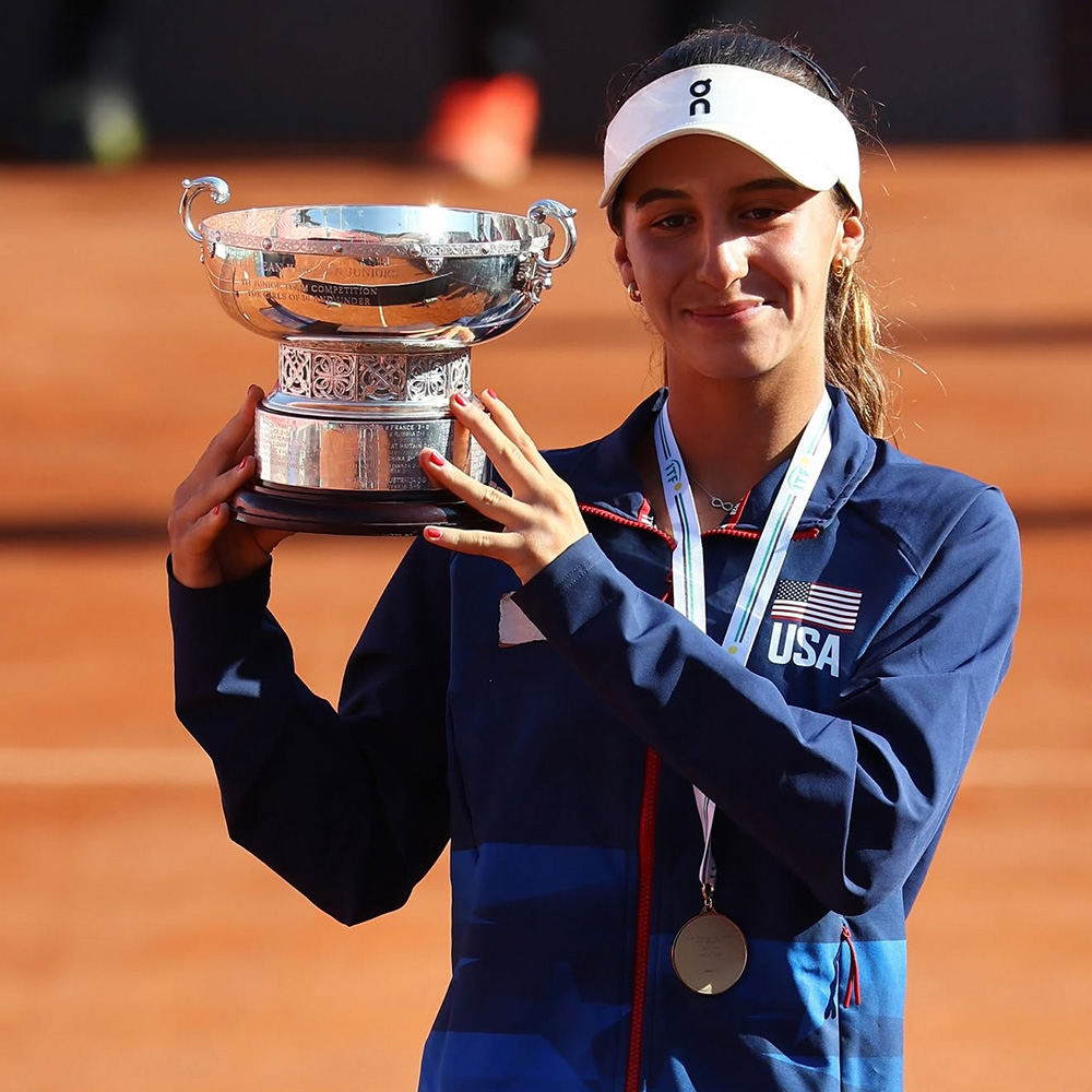 Julieta Pareja holding the Junior Billie Jean King Cup 2025 trophy