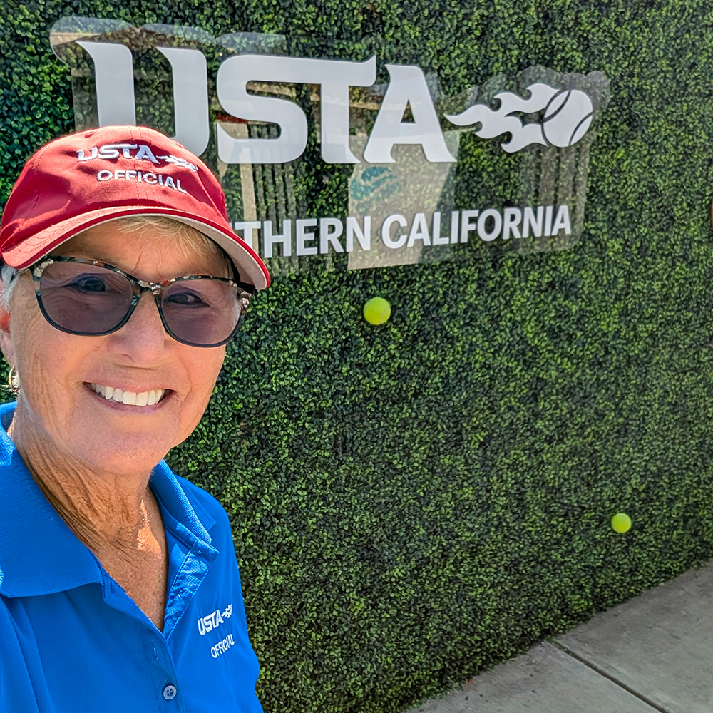 Ava Schumacher officiating a tennis event at Barnes Tennis Center in San Diego.