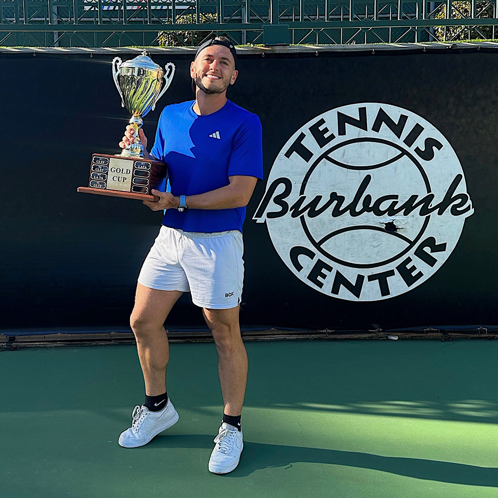 Trey Mihal with tennis trophy at Burbank Tennis Center