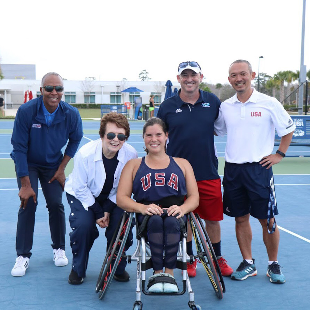 From left to right, Martin Blackman, Billie Jean King, Mackenzie Soldan, and Satoshi Ochi pose together at the USTA National Campus.