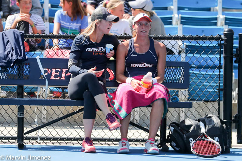 Lauren Embree coaching Luisa Stefani at Pepperdine University