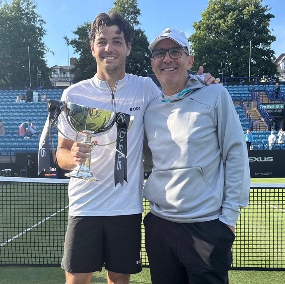 Taylor Fritz and Paul Annacone celebrate after Fritz captured his third Eastbourne title.