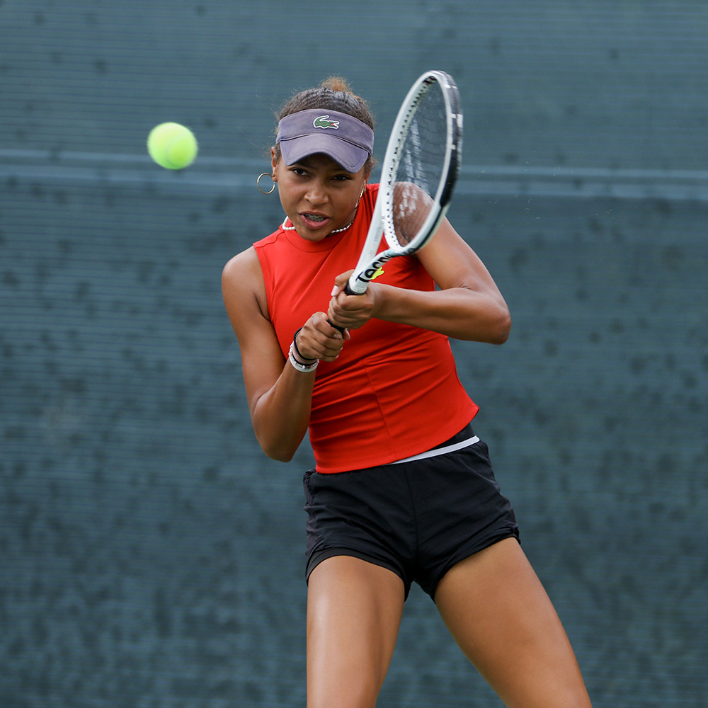 Thea Frodin hitting a backhand at the SoCal Pro Series when she earned her first WTA point
