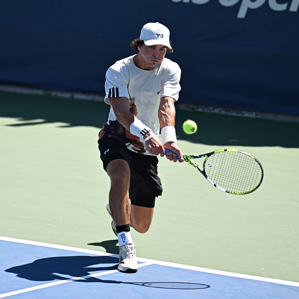 Keaton Hance hits a backhand during a junior boys' singles match at the 2025 US Open.