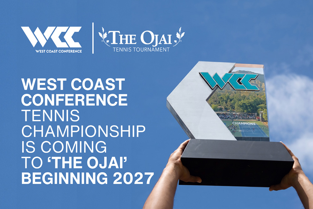 Two hands hold the West Coast Conference (WCC) championship trophy high overhead against a clear blue sky, celebrating the announcement that the WCC Tennis Championships will be coming to Libbey Park in 2027. The modern trophy features a dark rectangular base supporting a metallic silver and glass plaque topped with the turquoise and silver WCC logo, featuring an embedded image of tennis courts on the right.