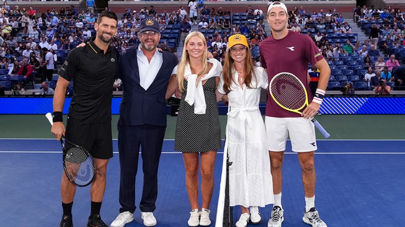 The family of Braun Levi, father Daniel, sister Adelle, and mother Jennifer Levi pose with Novak Djokovic and Jan-Lennard Struff before a men's singles match at the 2025 US Open on Sunday, Aug. 31, 2025 in Flushing, NY.