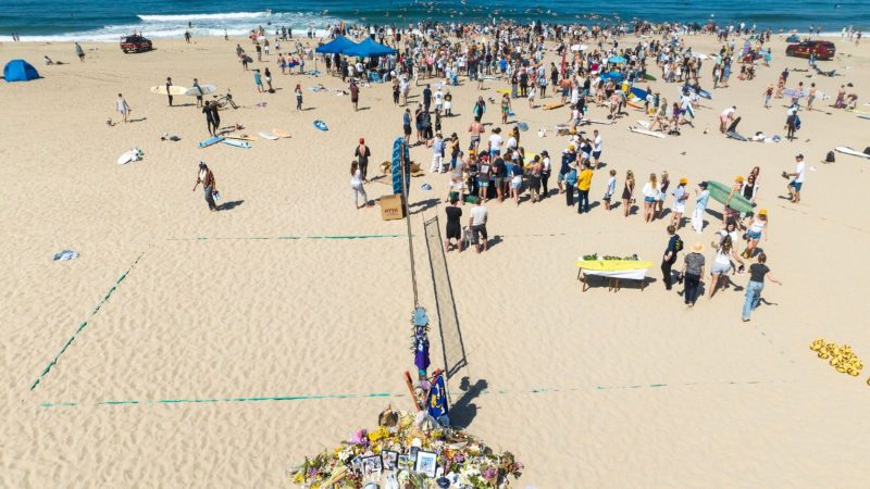 A volleyball court renamed “Braun’s Court” surrounded with memorabilia. (Photo – Bo Bridges)